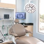 Dentist Chair with window in background photo of Dentist's chair at Stewart & Arango Oral Surgery